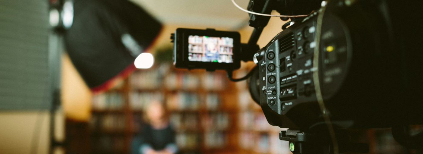 A woman being interviewed on video camera