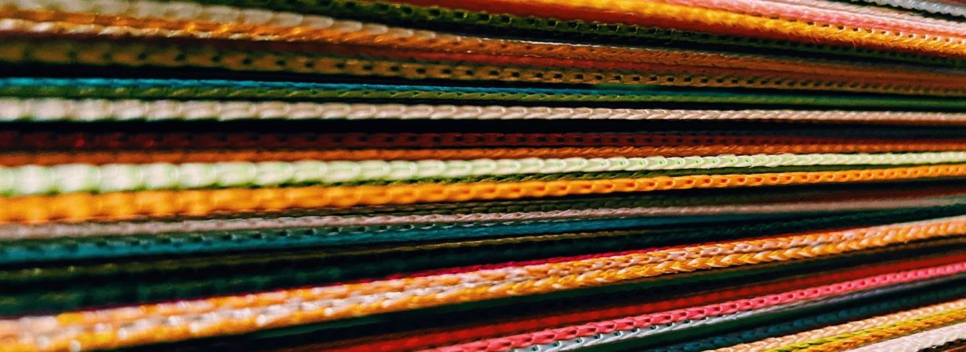Chains of multicolored threads displayed horizontally.